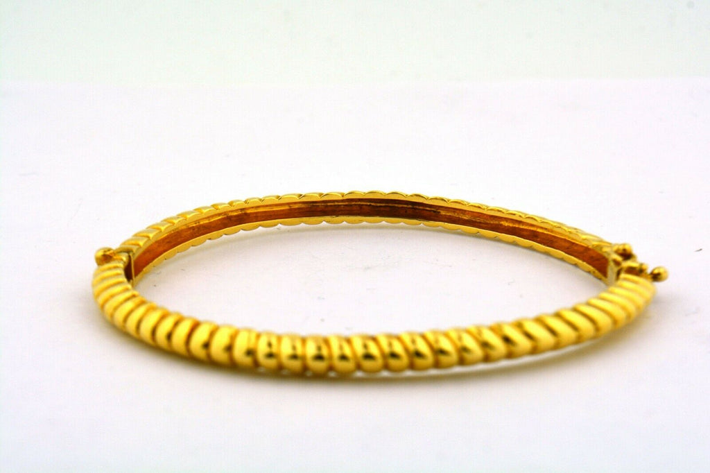 14 Karat Yellow Gold 4.2MM Ribbed Twist Hinged Oval Bracelet 15G - Jewelry Works